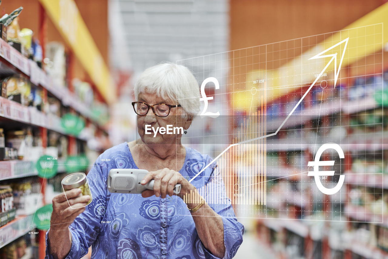 Financial chart and senior woman shopping in supermarket