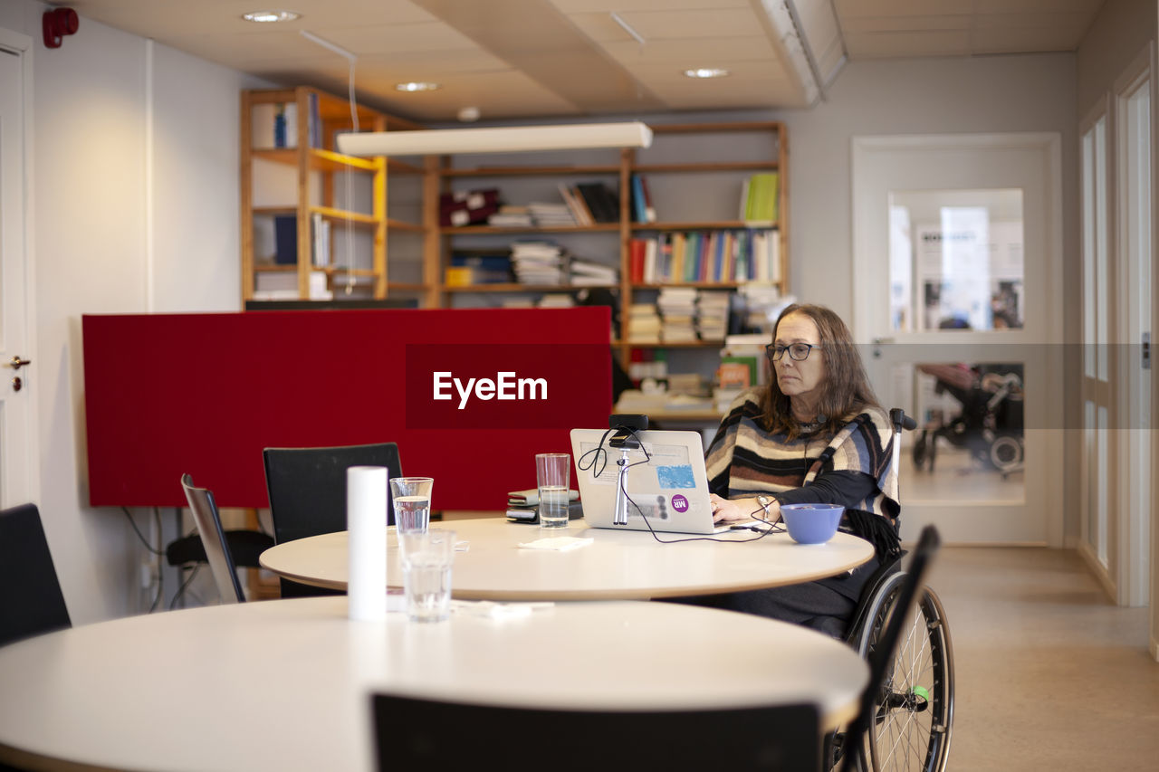 Disabled woman working in office