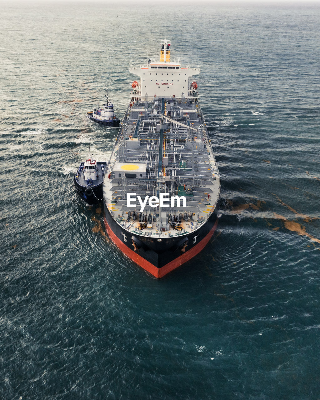 HIGH ANGLE VIEW OF NAUTICAL VESSEL SAILING IN SEA