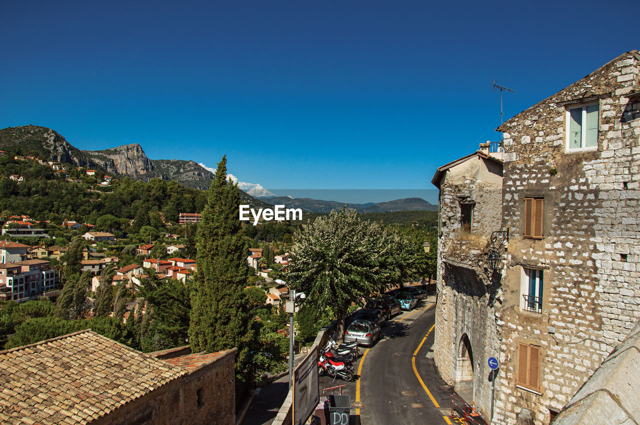 Panoramic view of hills and buildings outside vence, in the french provence.