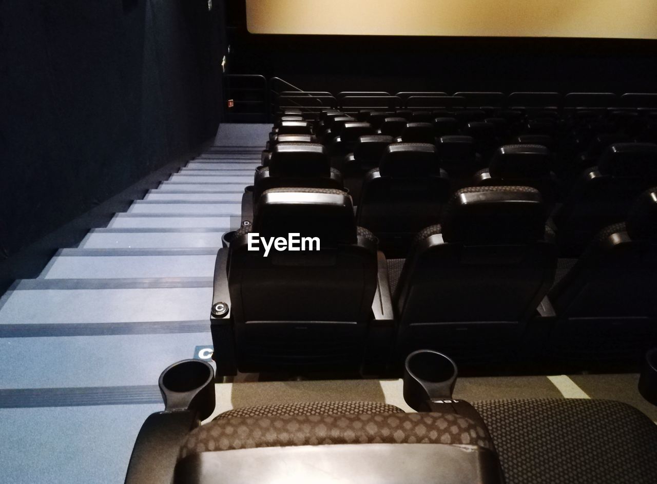 HIGH ANGLE VIEW OF SEATS ON TABLE IN SUBWAY