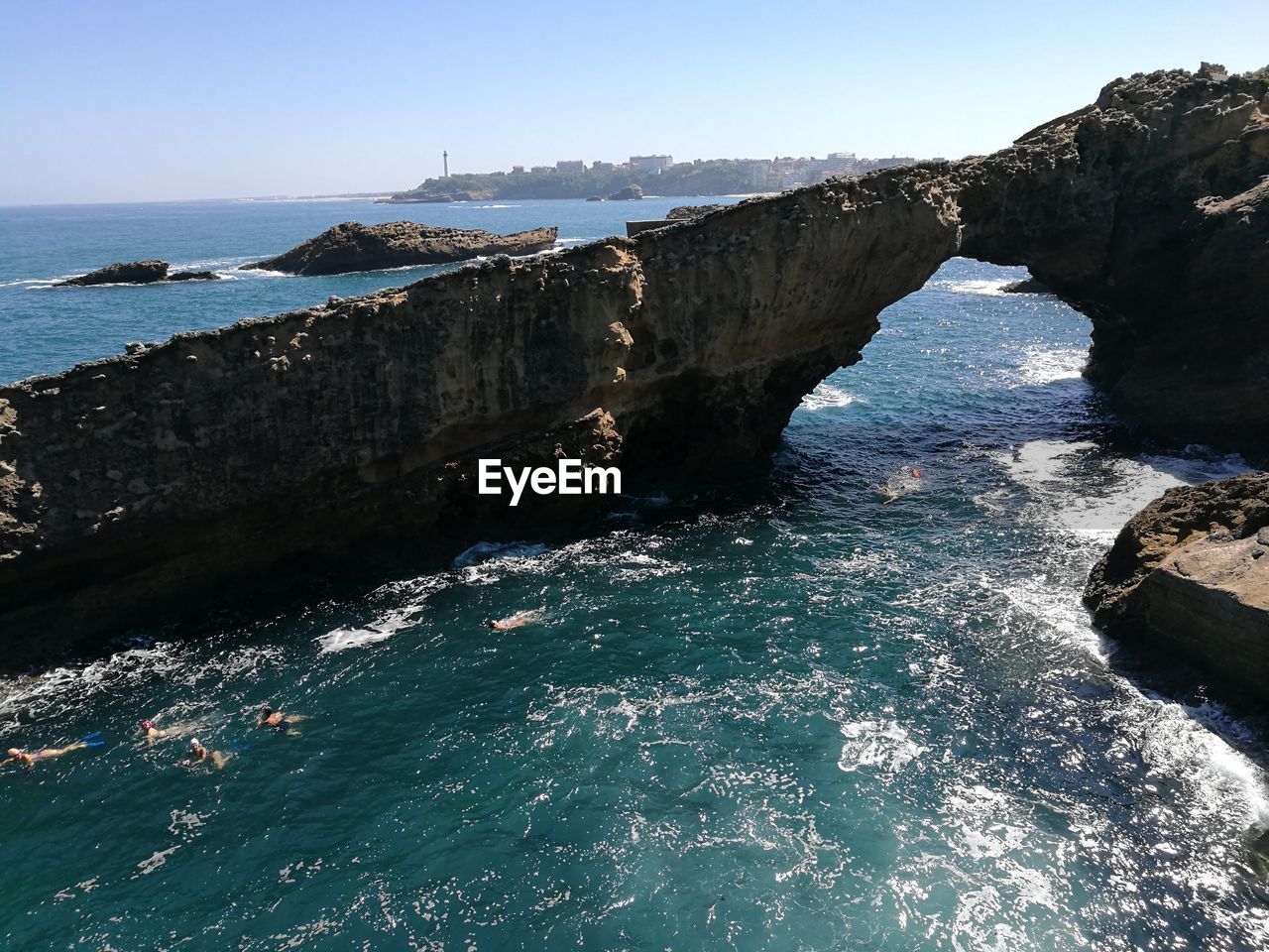 Scenic view of sea against clear blue sky