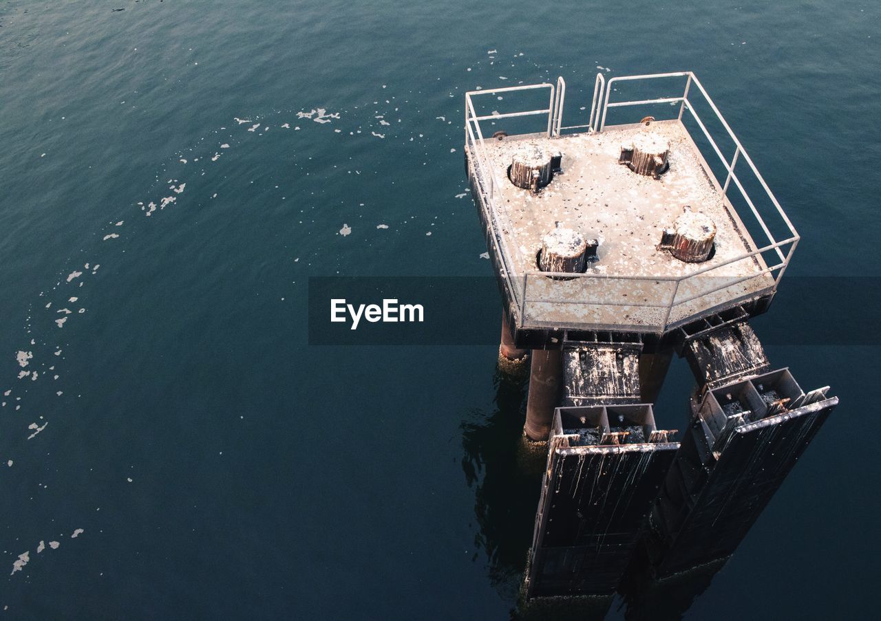High angle view of abandoned pier over sea