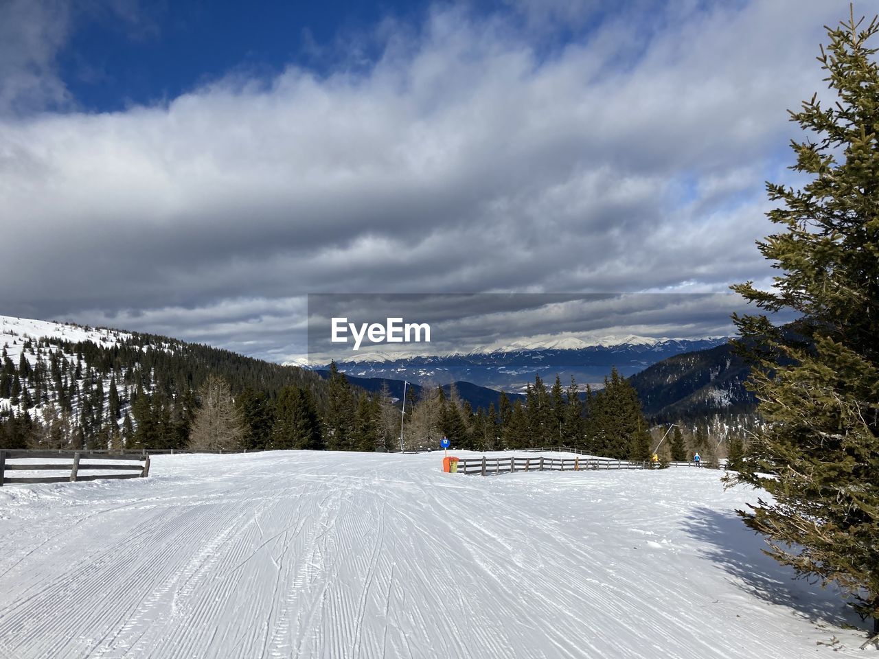 Scenic view of snow covered mountains against sky