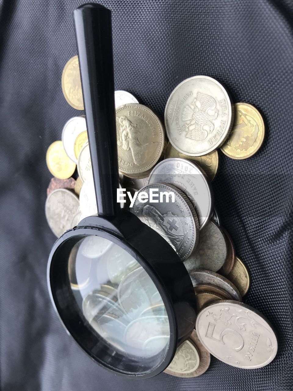 High angle view of coins on table