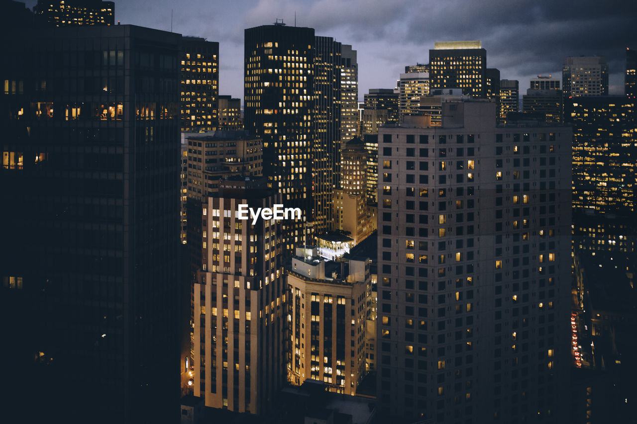 Illuminated buildings in city at night