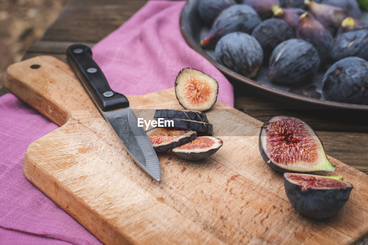 Fresh figs on wooden board