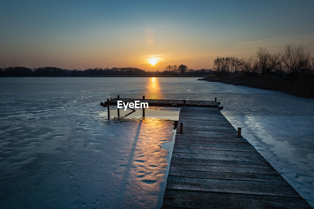 Scenic view of pier against sky during sunset