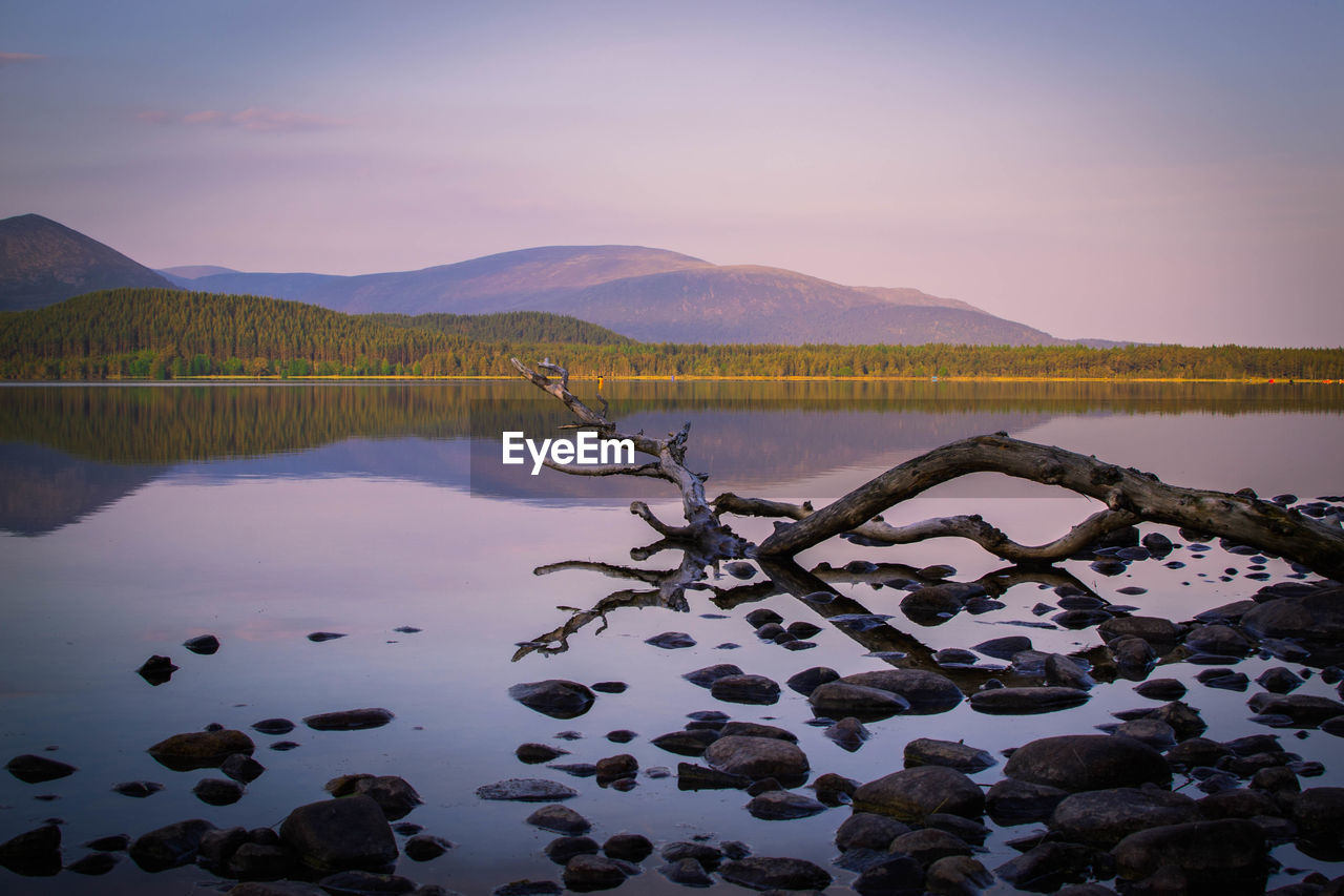 Scenic view of lake against sky during sunset