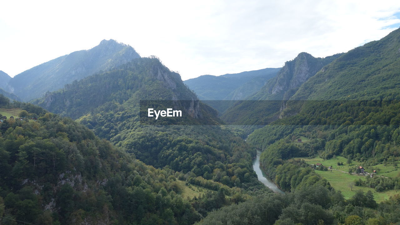 SCENIC VIEW OF MOUNTAINS AND VALLEY