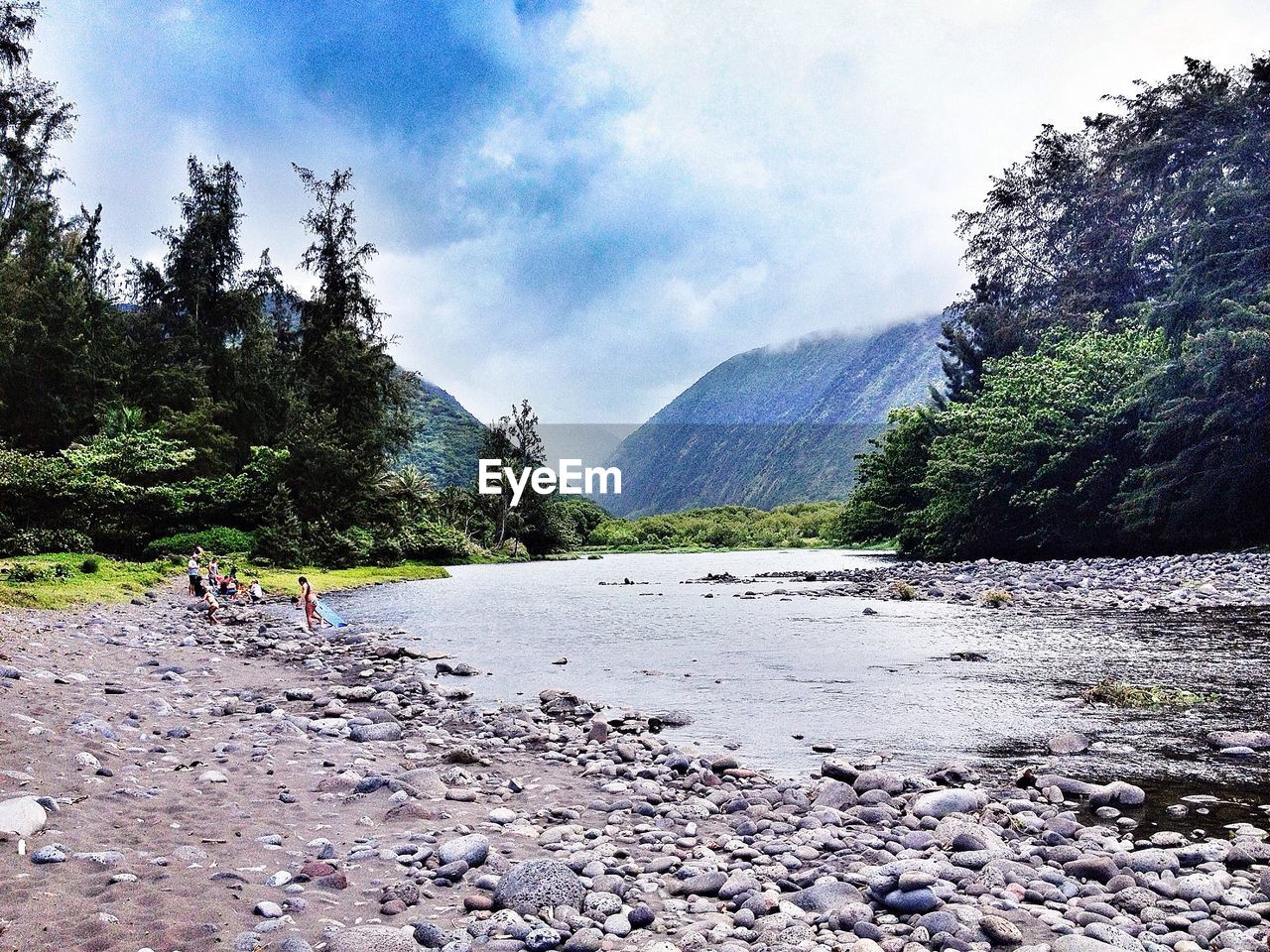 SCENIC VIEW OF MOUNTAINS AGAINST CLOUDY SKY