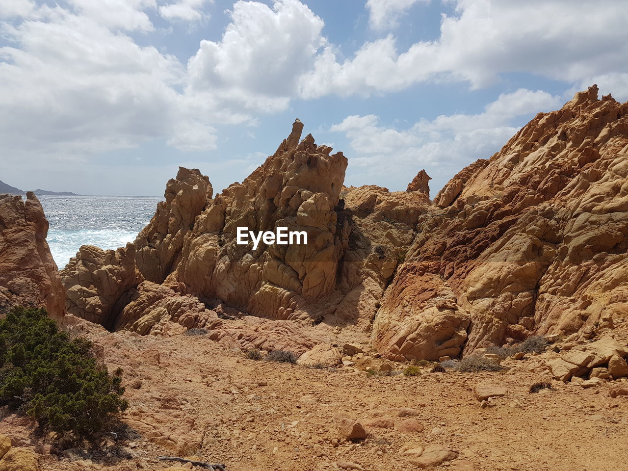 Rock formations on landscape against sky