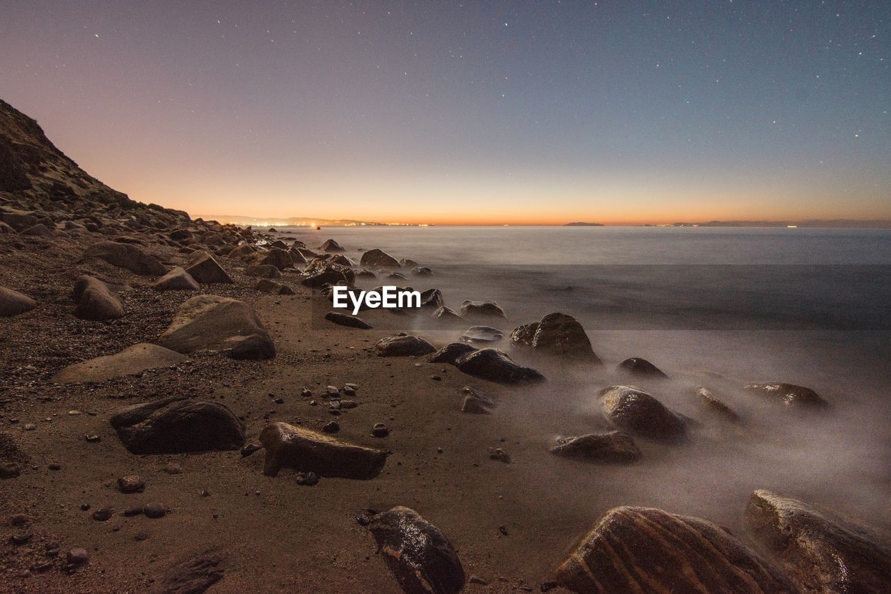 Scenic view of sea against sky during sunset