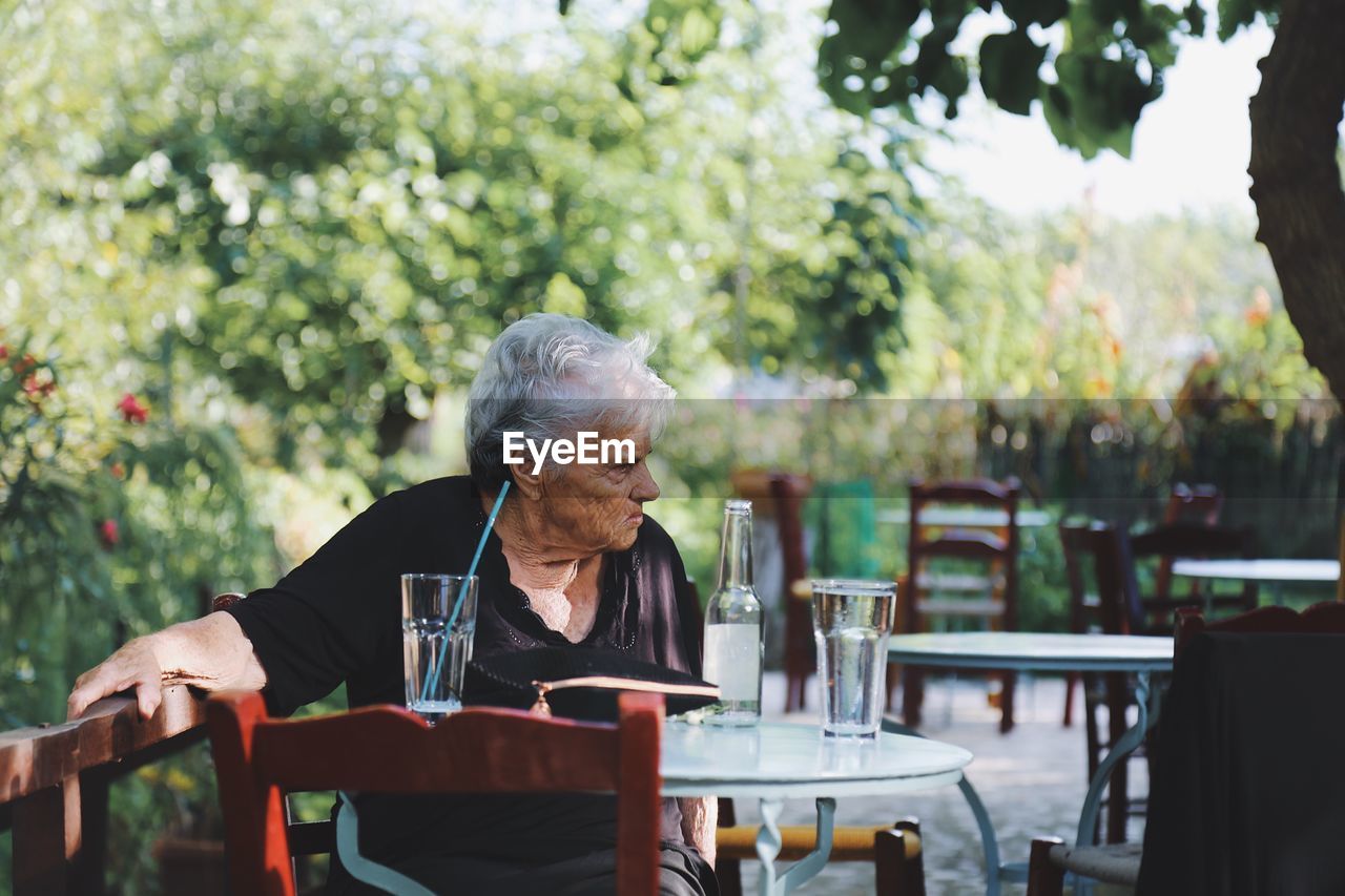 MAN SITTING AT RESTAURANT