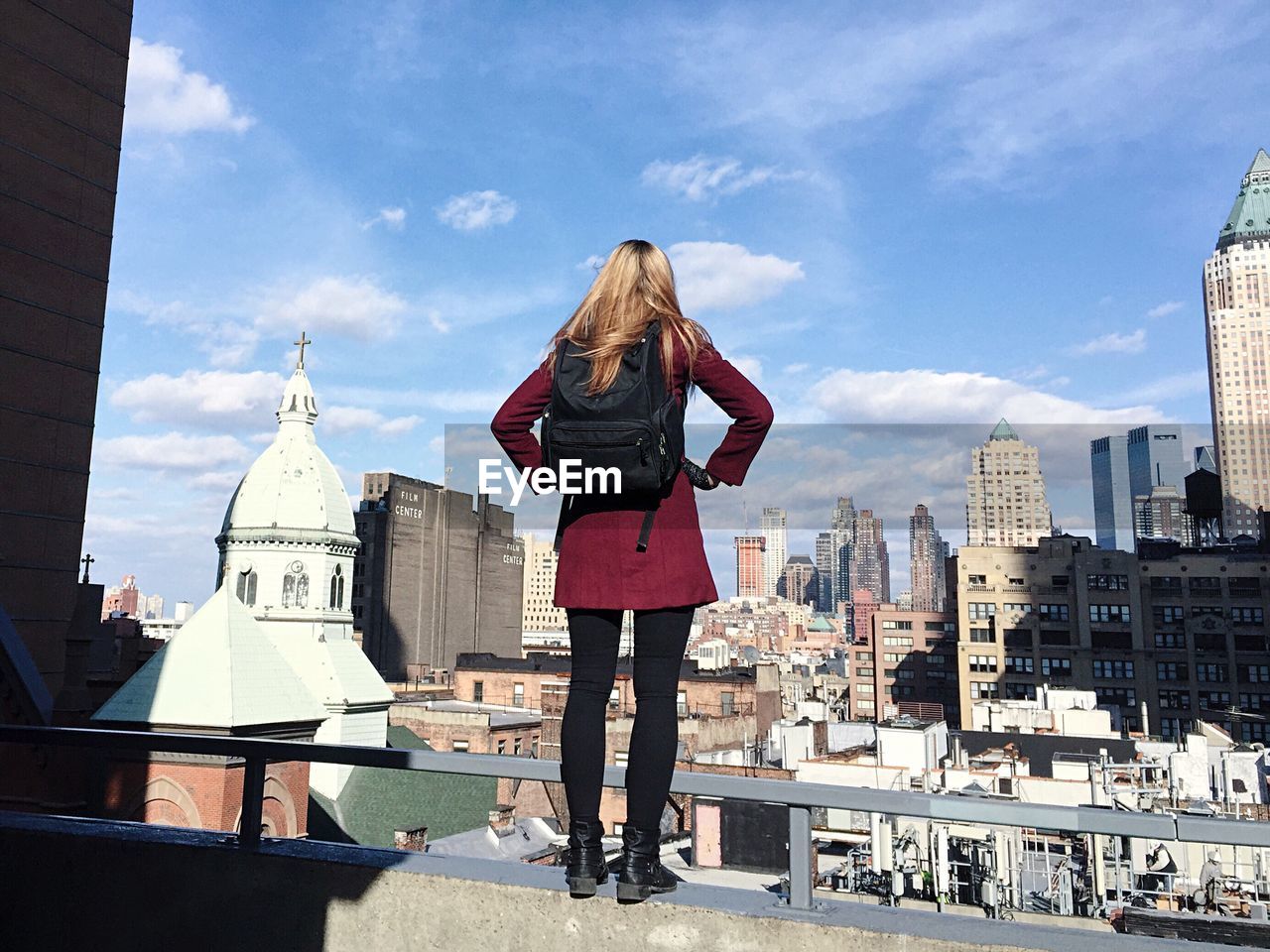 Woman standing on rooftop