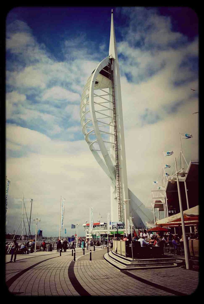 VIEW OF FERRIS WHEEL AGAINST CLOUDY SKY