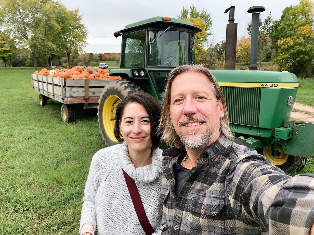 adult, smiling, portrait, two people, men, happiness, looking at camera, tractor, emotion, plant, togetherness, rural scene, agriculture, farm, mature adult, women, landscape, nature, cheerful, vehicle, field, day, positive emotion, mode of transportation, transportation, female, green, land vehicle, agricultural machinery, love, front view, casual clothing, farmer, teeth, occupation, smile, bonding, crop, agricultural equipment, food and drink, outdoors, food, lifestyles, growth, tree, waist up, harvesting, enjoyment, headshot, grass