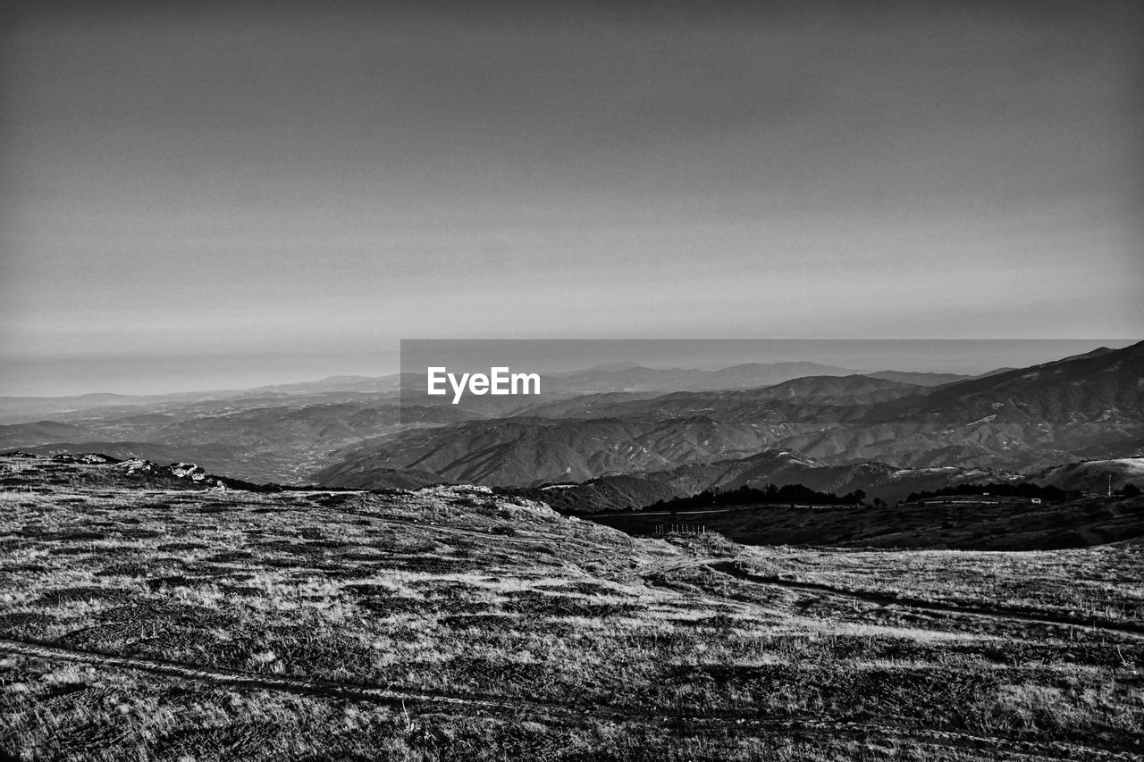 black and white, environment, monochrome photography, monochrome, landscape, darkness, mountain, scenics - nature, horizon, sky, beauty in nature, cloud, nature, tranquility, no people, land, black, tranquil scene, mountain range, white, non-urban scene, rock, snow, day, outdoors, travel destinations, remote, travel