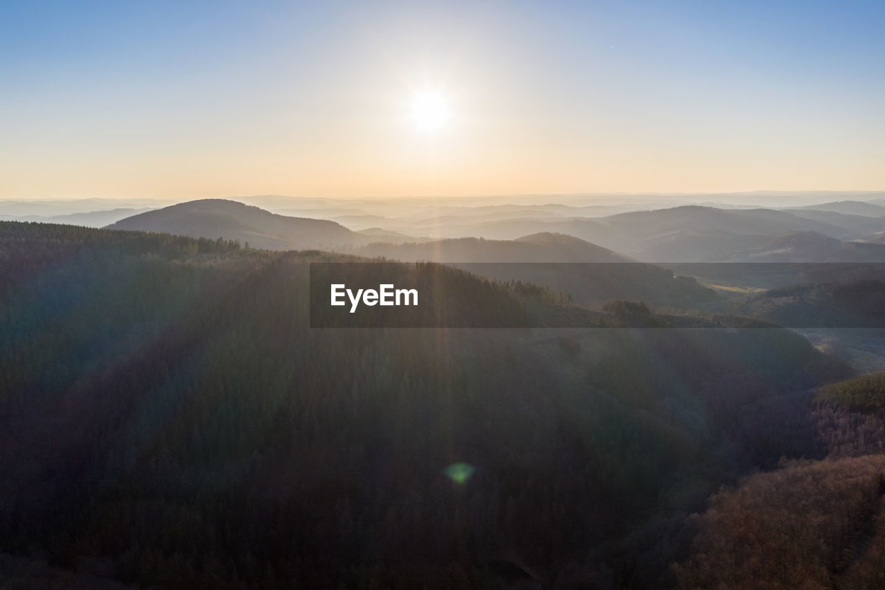 SCENIC VIEW OF LANDSCAPE AGAINST SKY AT SUNSET