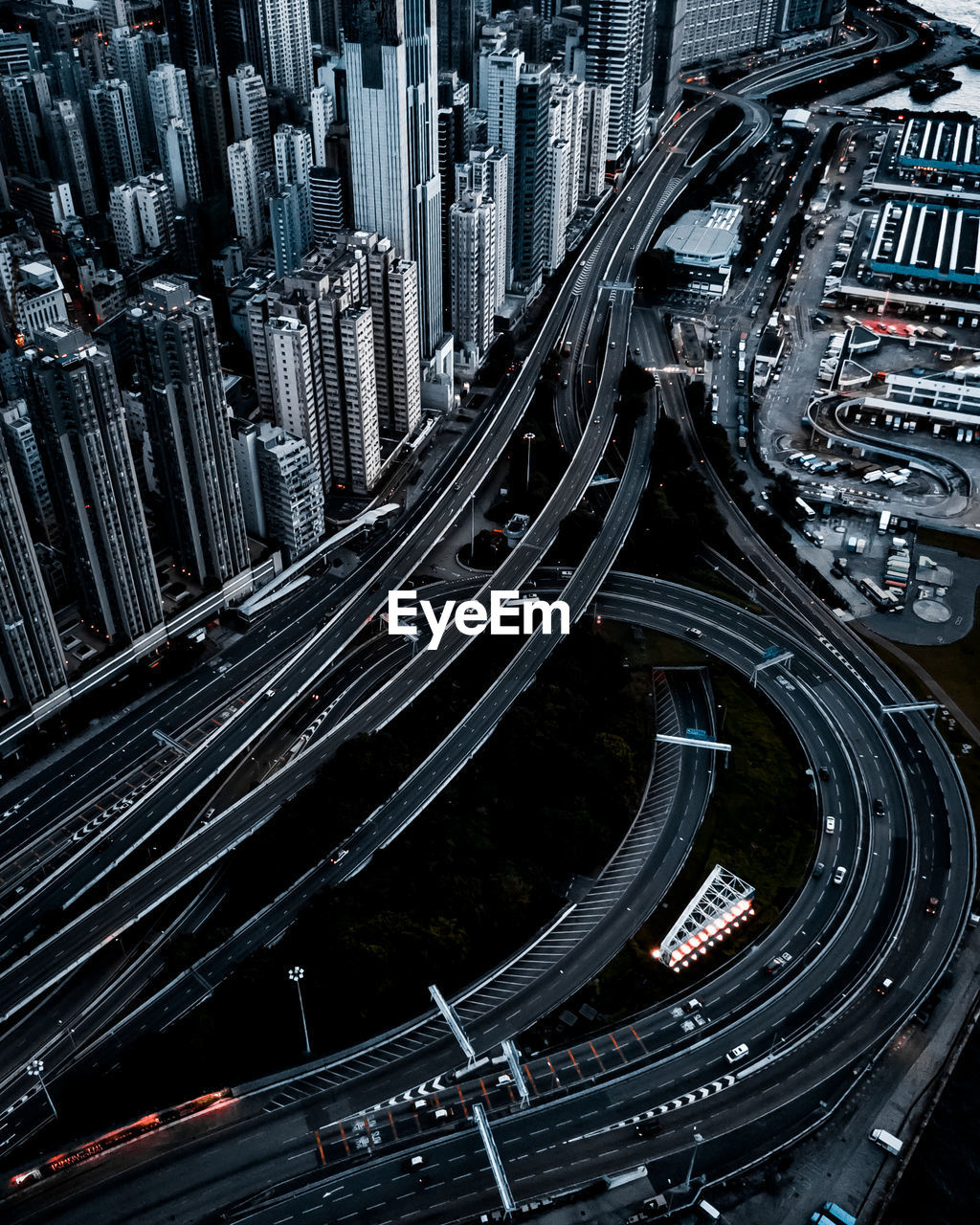 Aerial view of elevated road amidst buildings in city