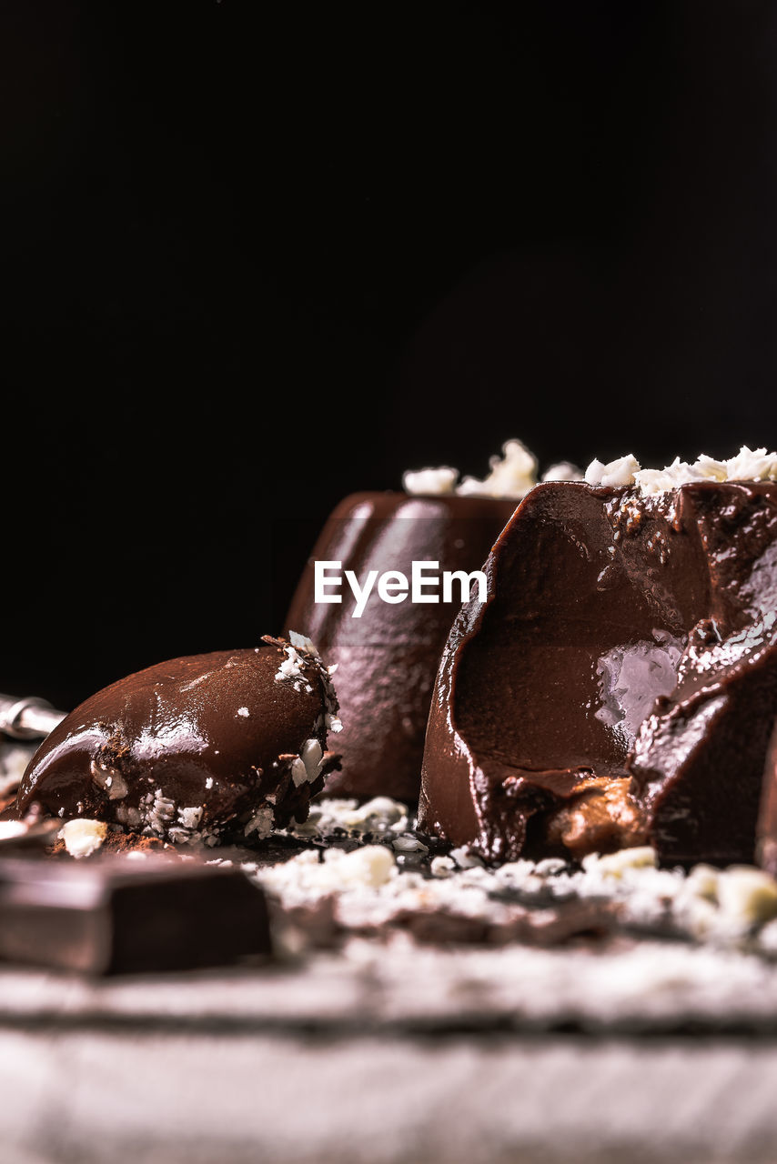 CLOSE-UP OF CHOCOLATE ON TABLE