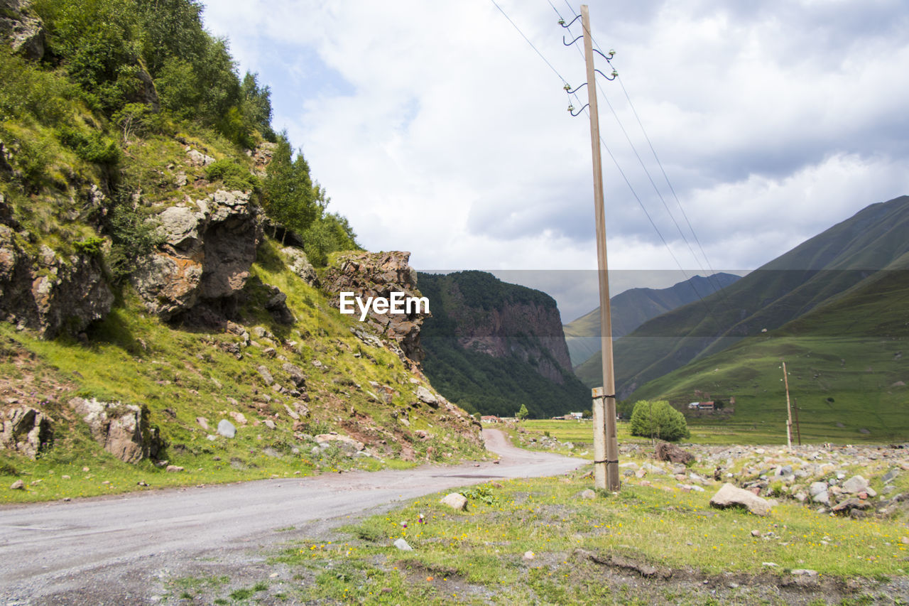 ROAD LEADING TOWARDS MOUNTAINS