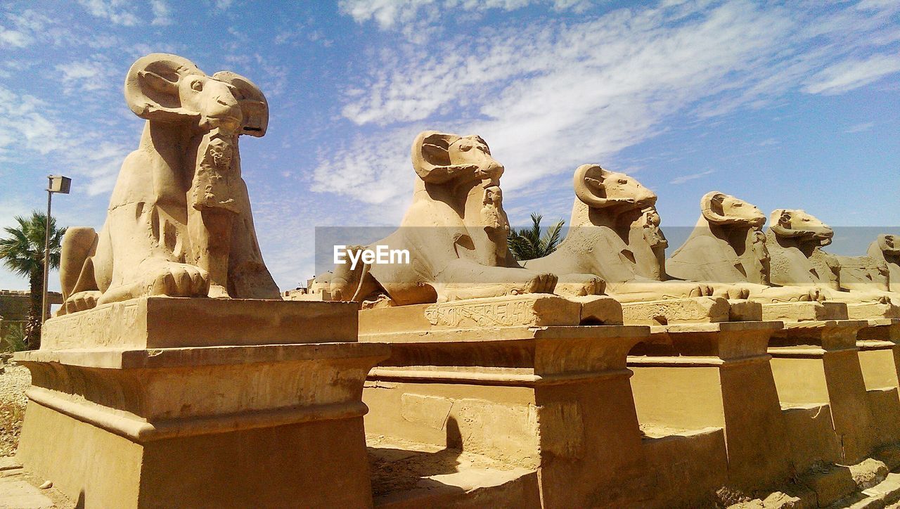 LOW ANGLE VIEW OF STATUE
