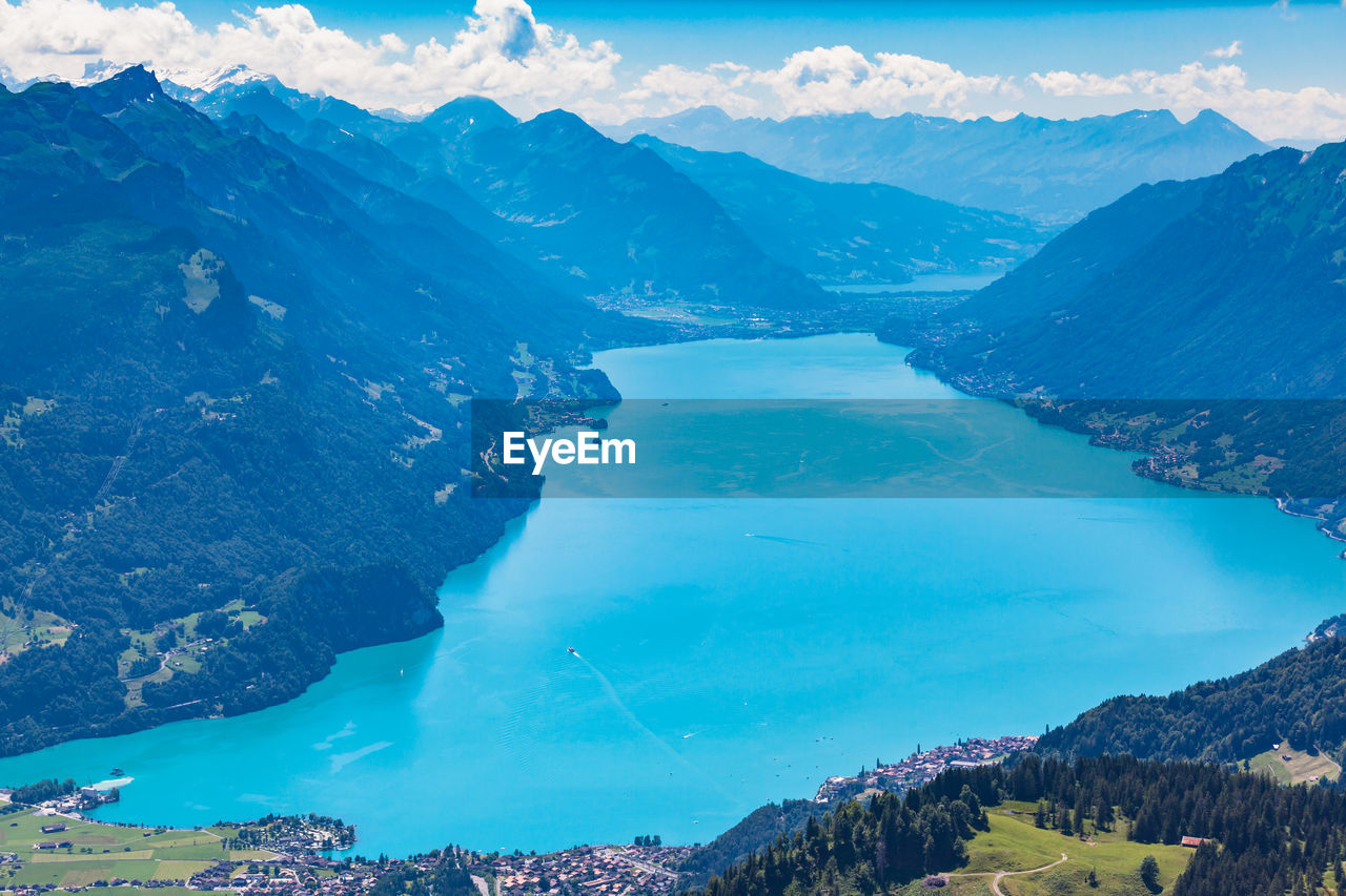 Panoramic view of sea and mountains against sky