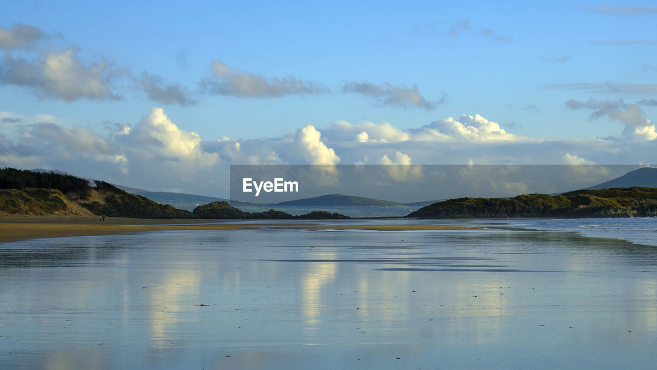 water, reflection, mountain, lake, sky, body of water, scenics - nature, beauty in nature, cloud, shore, tranquility, nature, land, environment, tranquil scene, landscape, reservoir, horizon, morning, no people, mountain range, travel destinations, beach, bay, coast, travel, dusk, ocean, outdoors, day, non-urban scene, idyllic, lagoon, tourism, blue