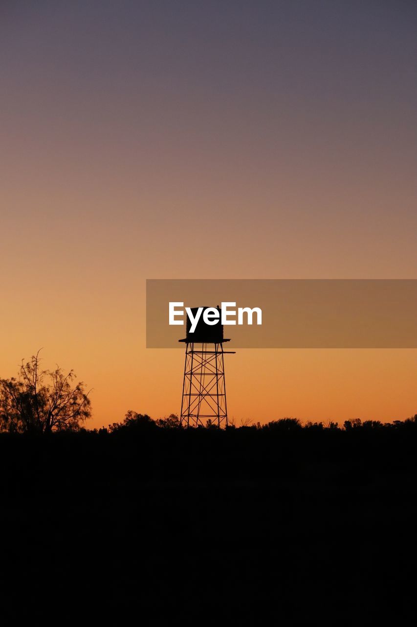 sky, silhouette, sunset, horizon, dawn, built structure, tower, architecture, no people, orange color, nature, copy space, water tower - storage tank, evening, water tower, scenics - nature, tranquility, lookout tower, technology, beauty in nature, afterglow, outdoors, sun, tranquil scene