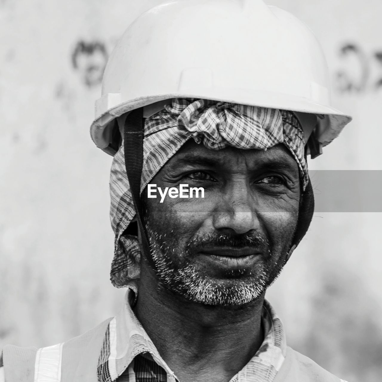 Close-up of mature man wearing hardhat