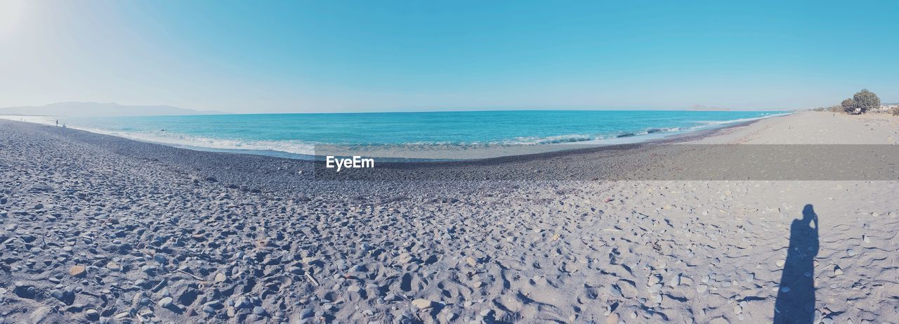 SCENIC VIEW OF CALM SEA AGAINST CLEAR BLUE SKY