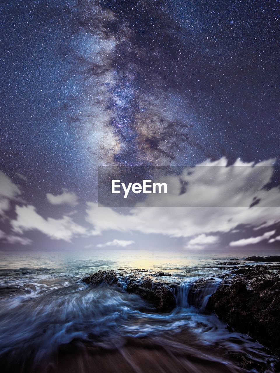 Scenic view of sea against sky at night