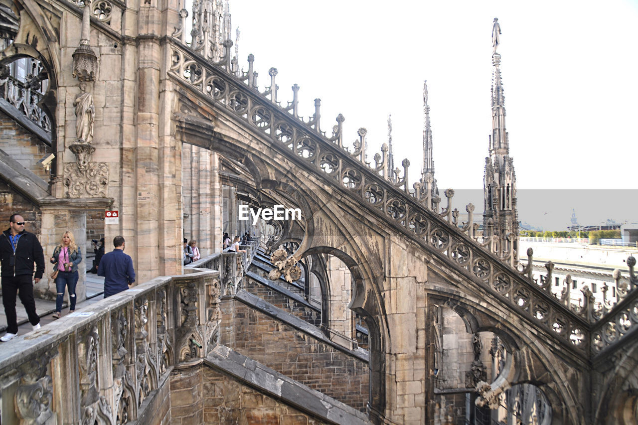 People in front of historic building