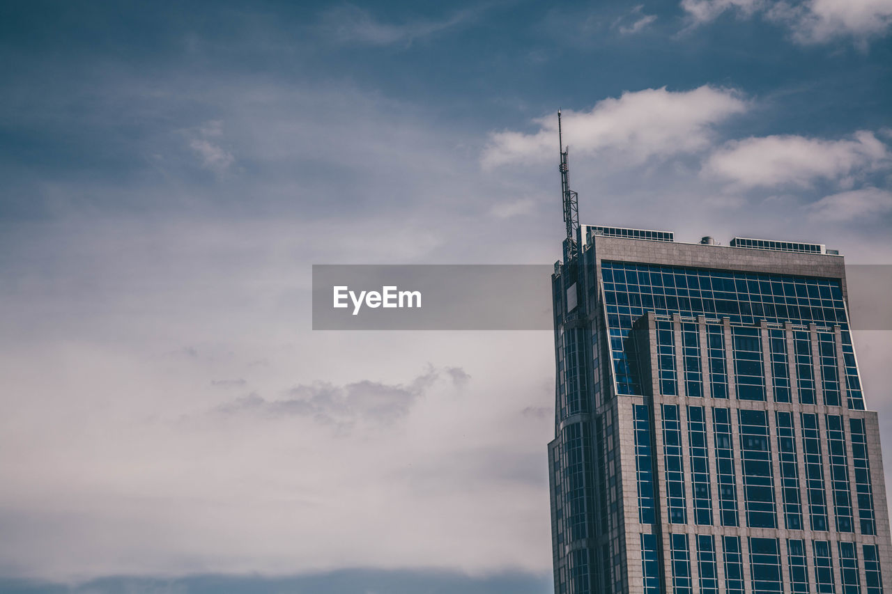 Low angle view of skyscraper against sky