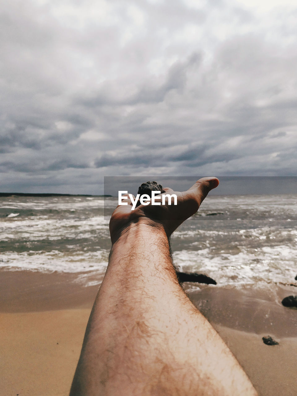 MAN RELAXING ON BEACH