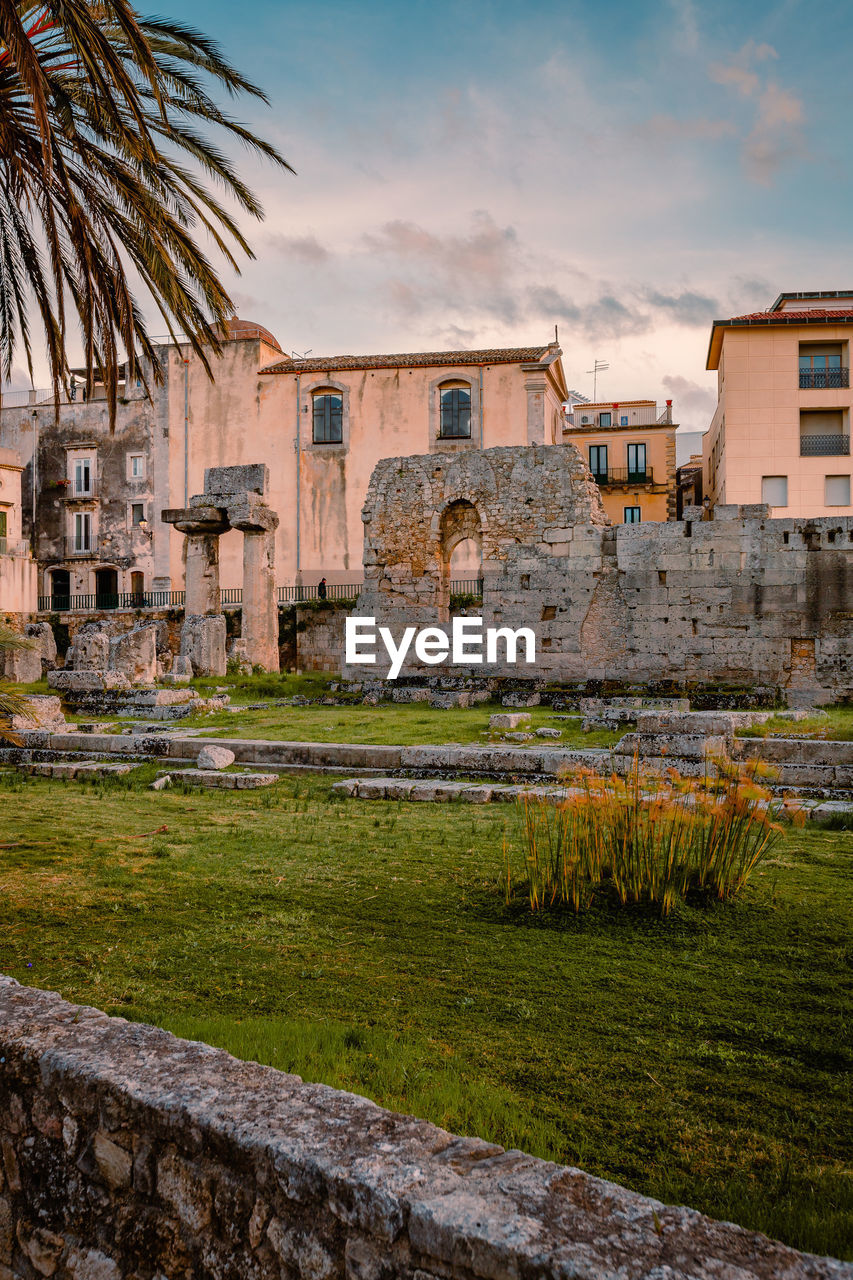 Temple of apollo in the centre of ortigia, syracuse at sunset