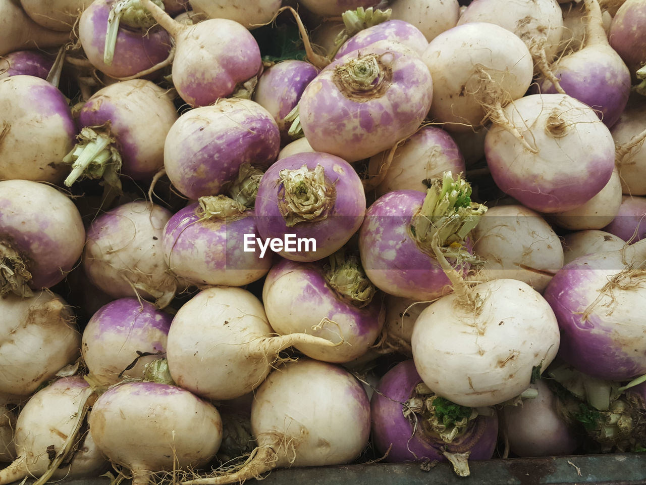 Full frame shot of onions for sale at market stall