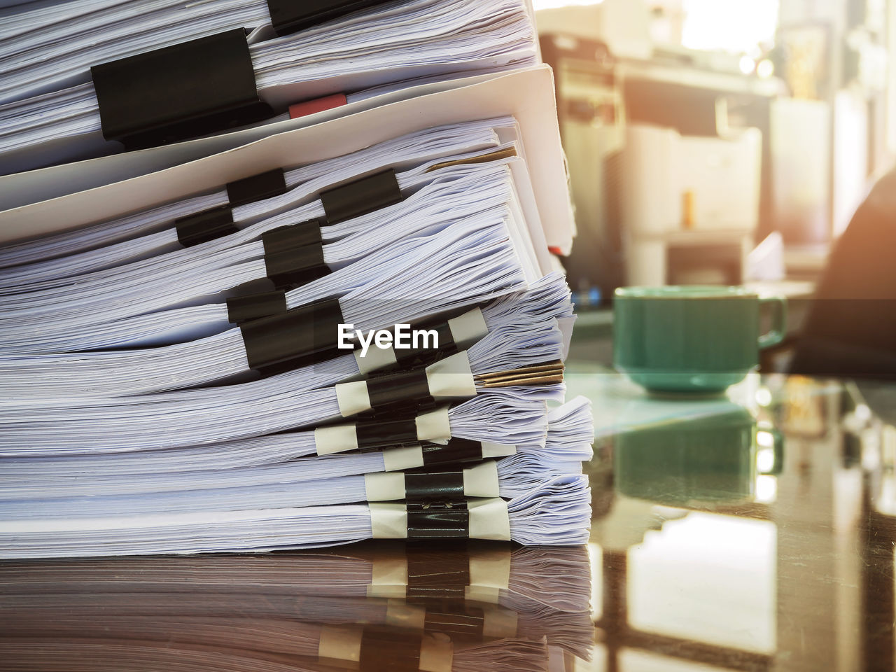 Close-up of stack of papers on table