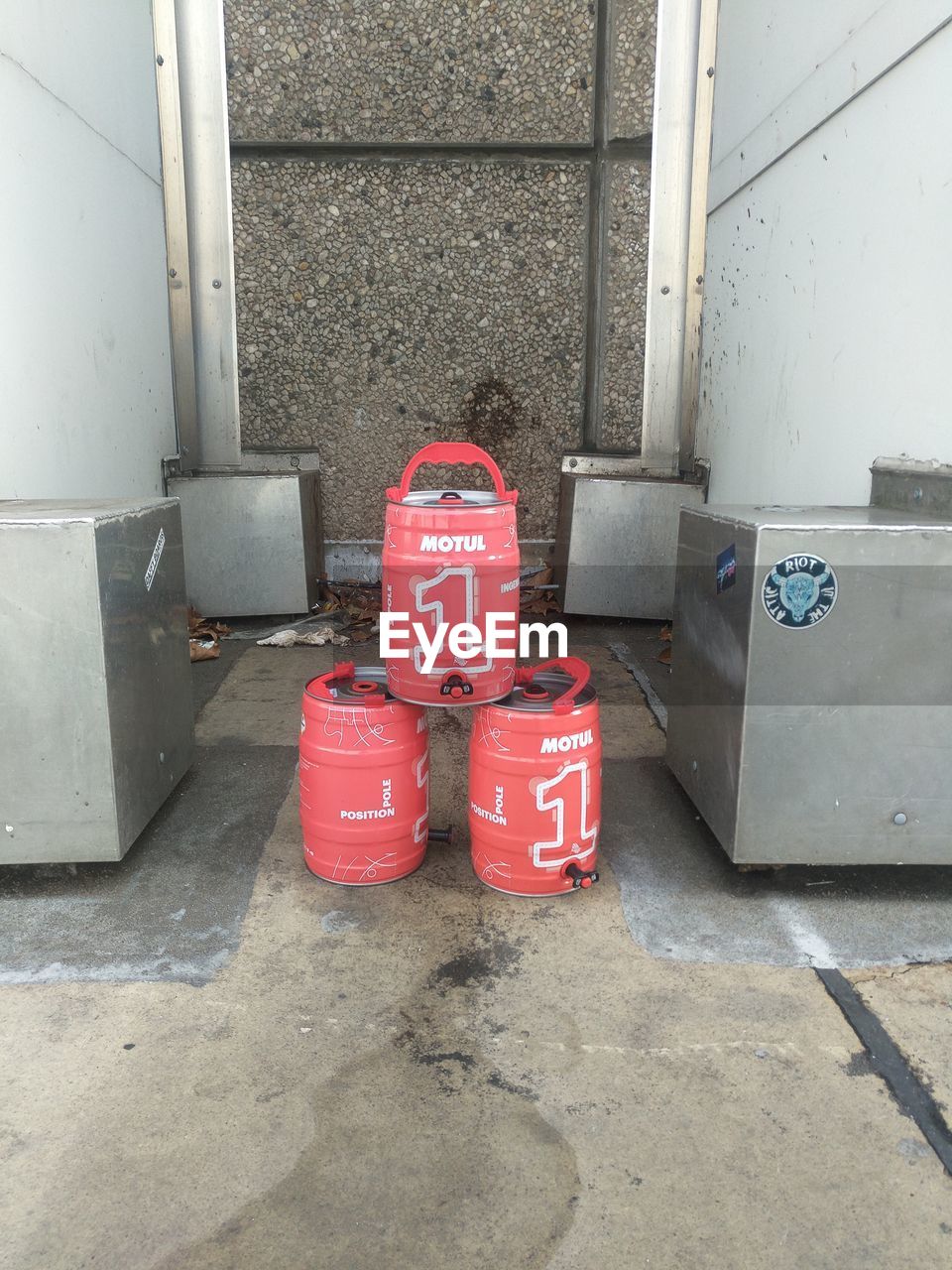 RED FIRE HYDRANT AGAINST WALL AND SIGN