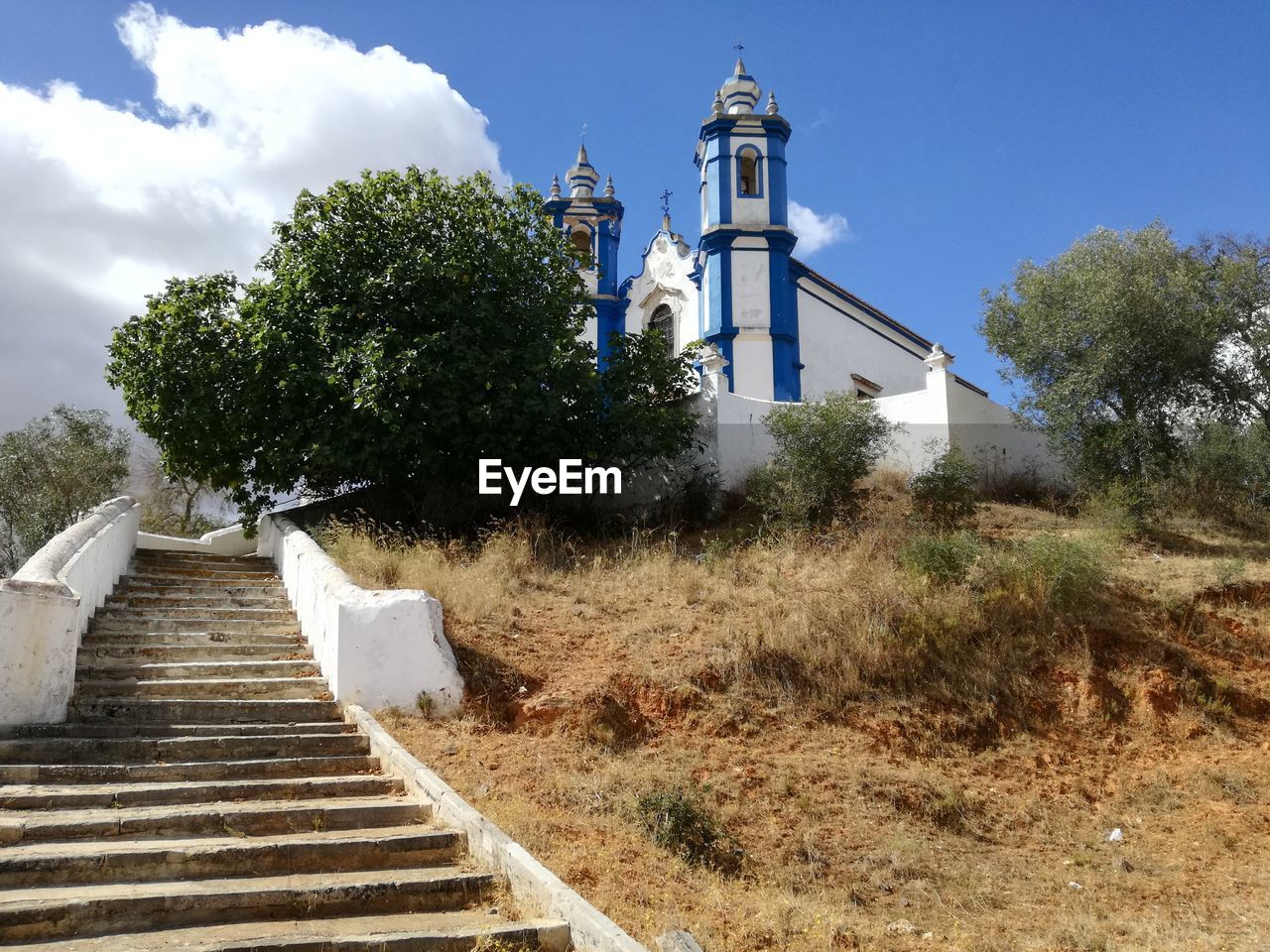 LOW ANGLE VIEW OF STEPS LEADING TOWARDS BUILT STRUCTURE