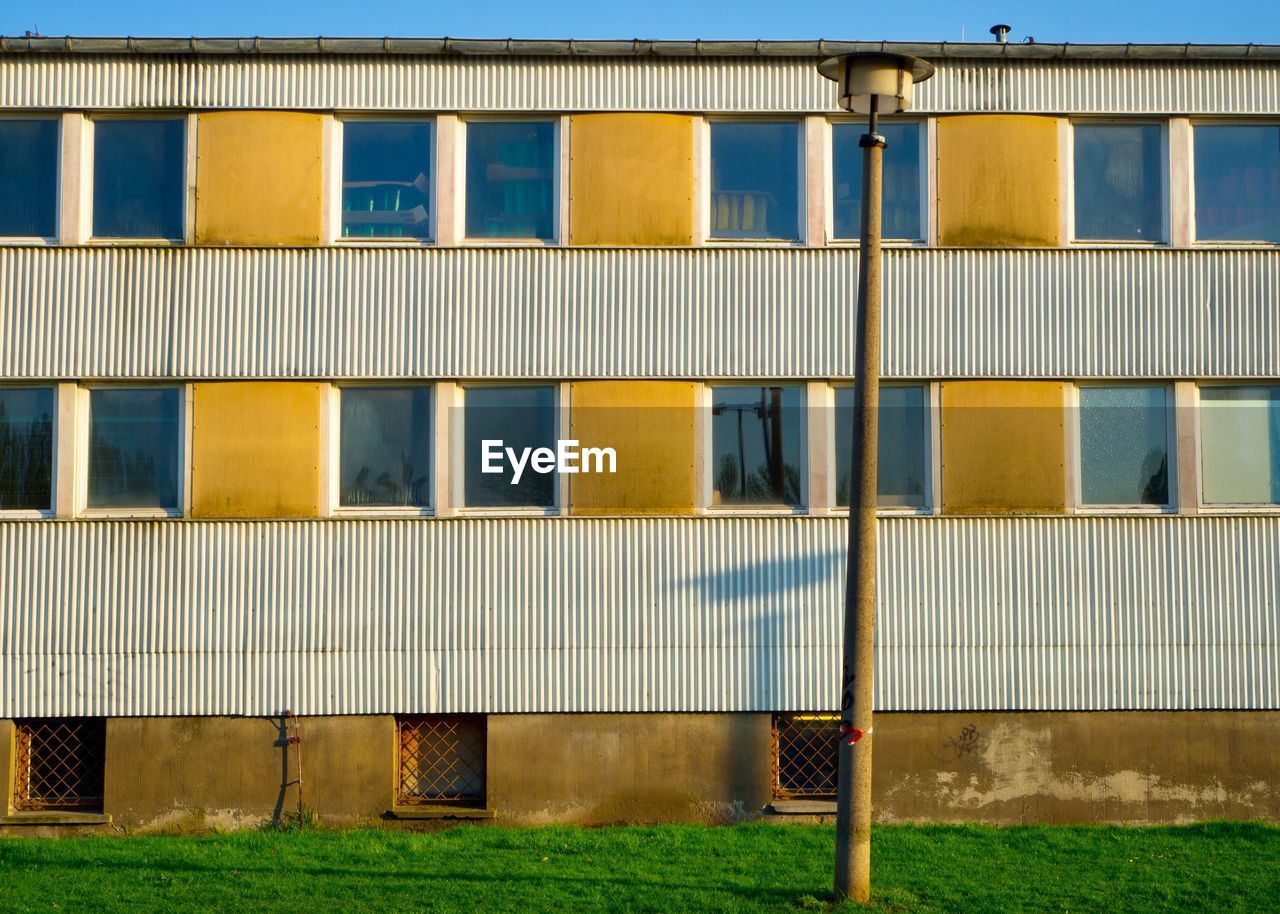 FULL FRAME SHOT OF BUILDING WITH YELLOW WALL