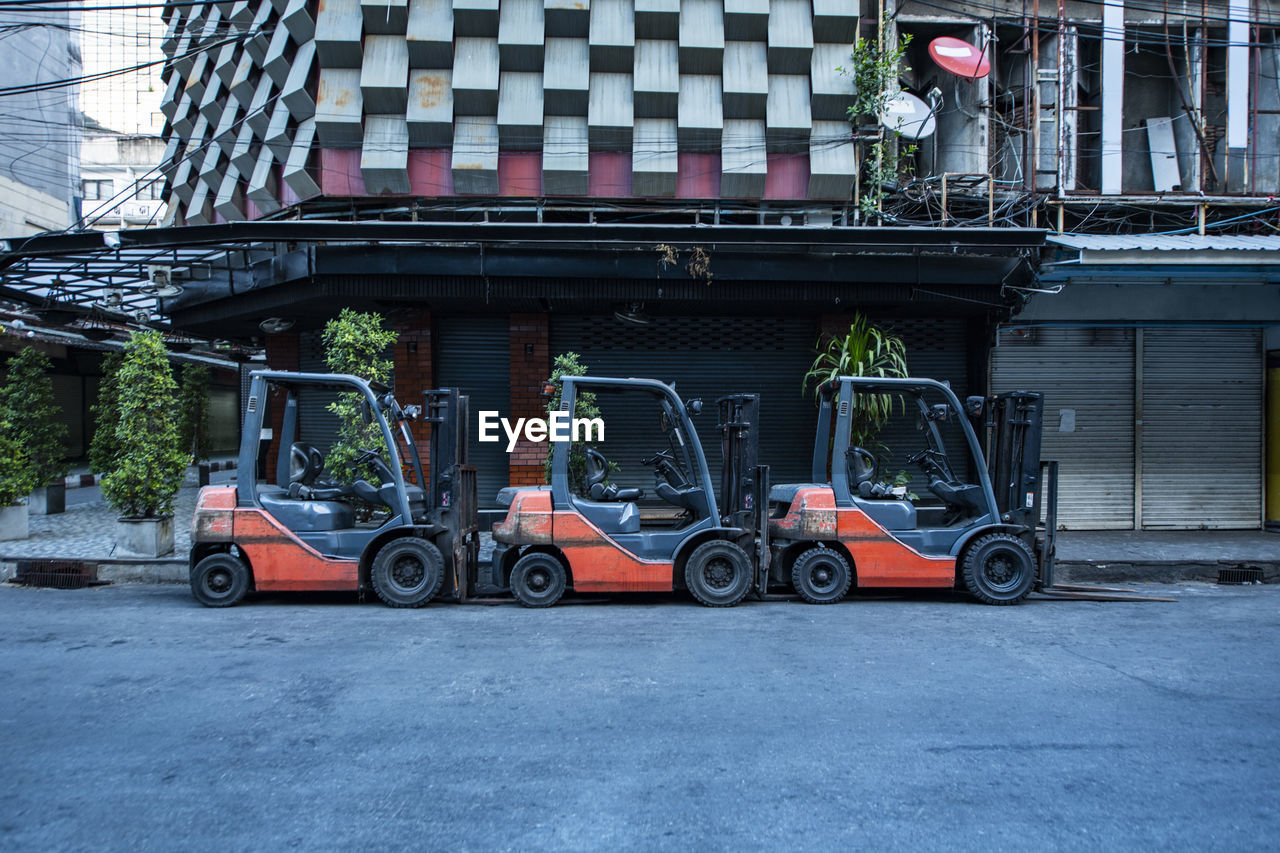 Fork lift trucks parked on empty street in the patpong area of bangkok