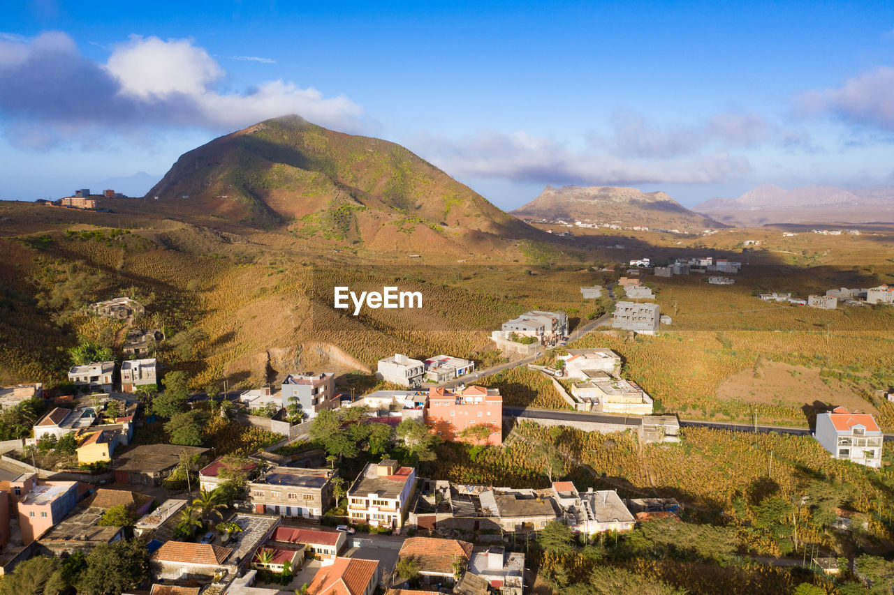 TOWNSCAPE AGAINST MOUNTAIN