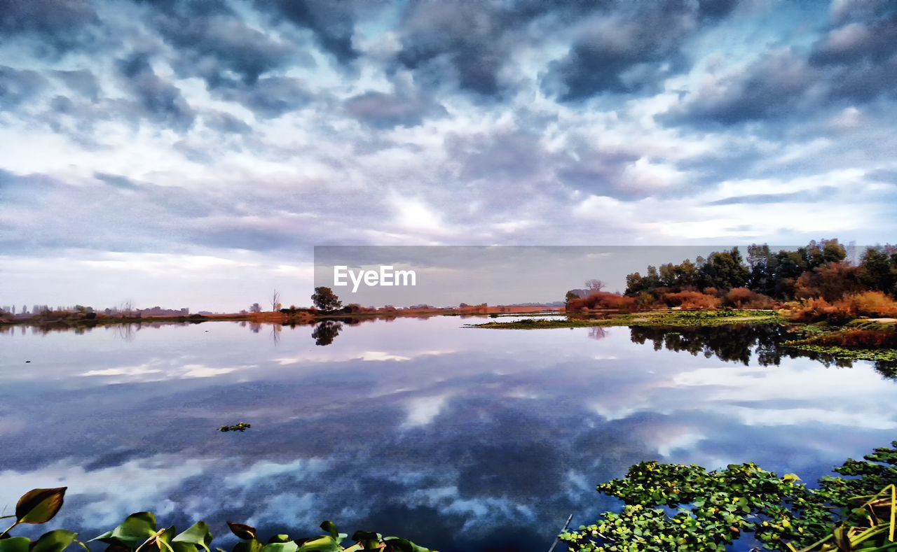 REFLECTION OF SKY ON LAKE