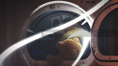 Close up of teddy bear in washing machine ID 102120799