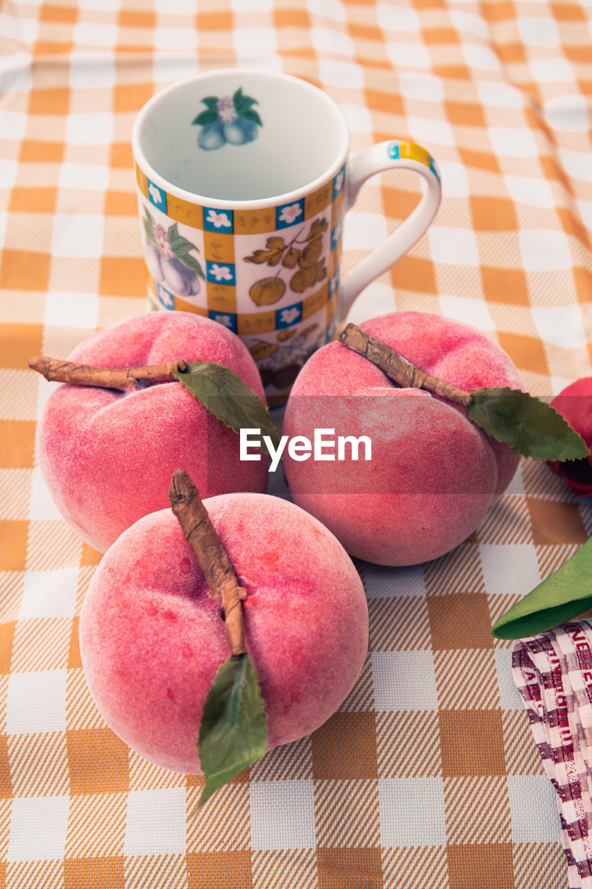 CLOSE-UP OF FRUITS ON TABLE AT HOME