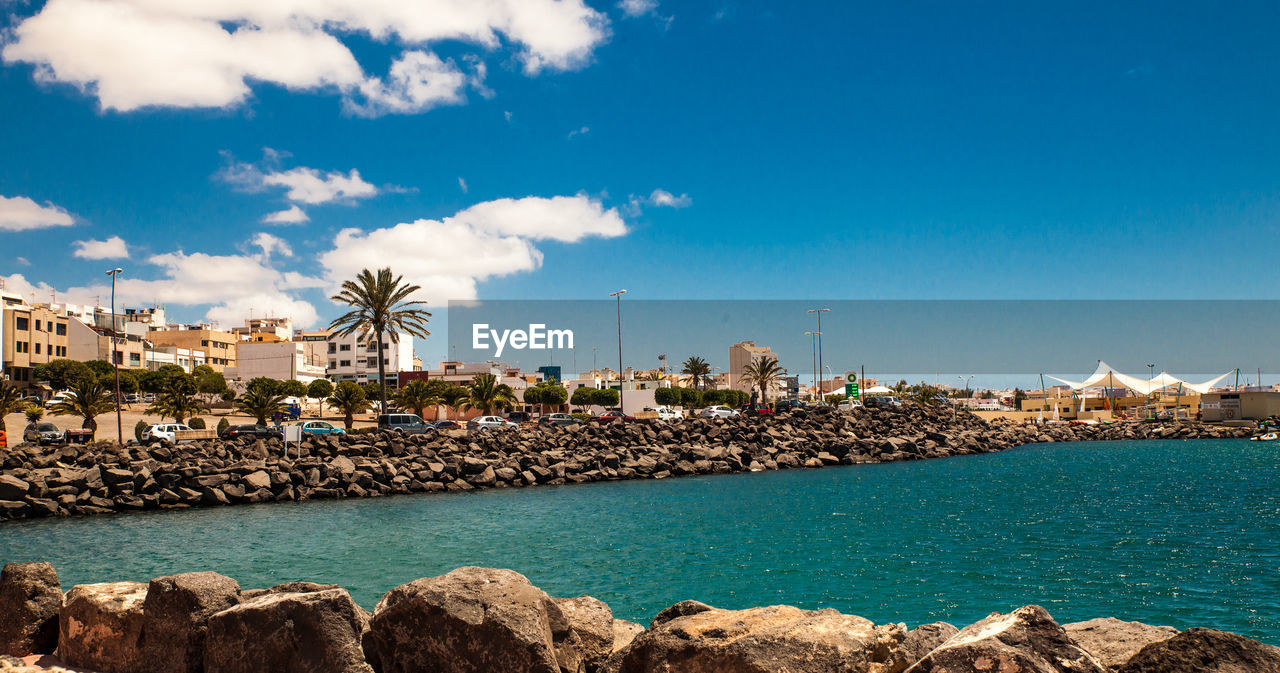 Panoramic view of sea against blue sky