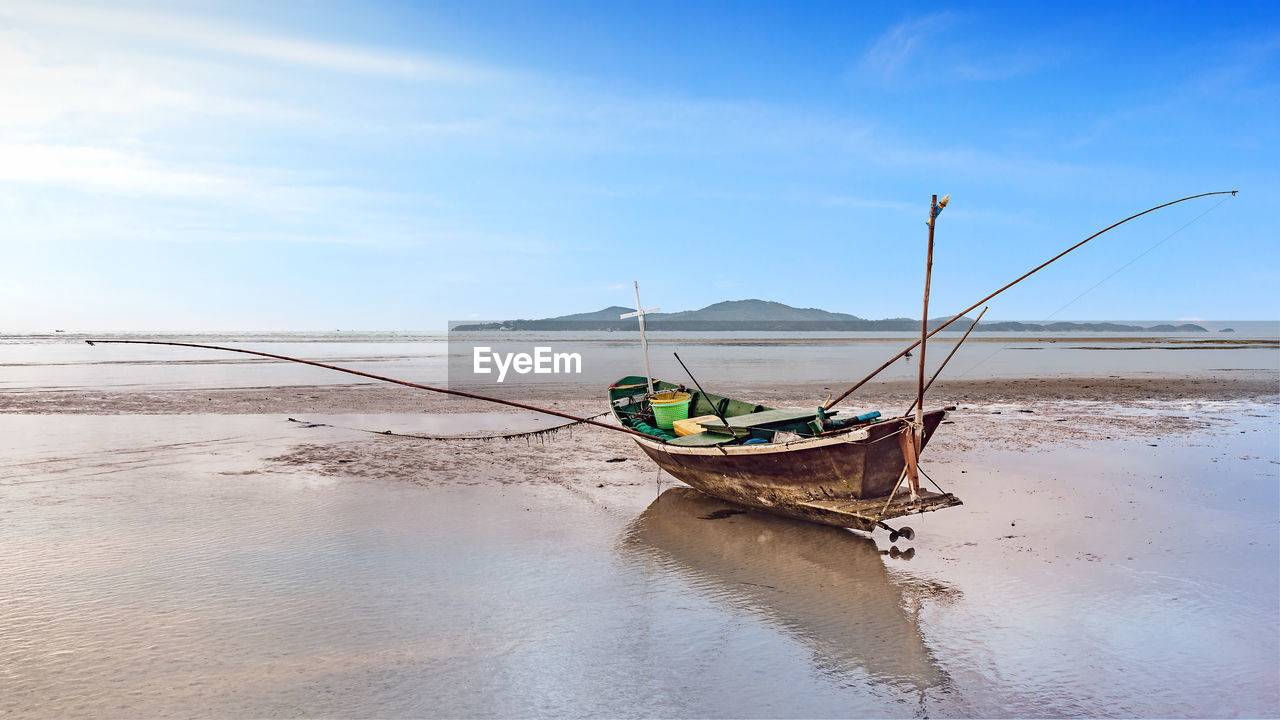 Calmness seascape with fishing boat in morning sunrise