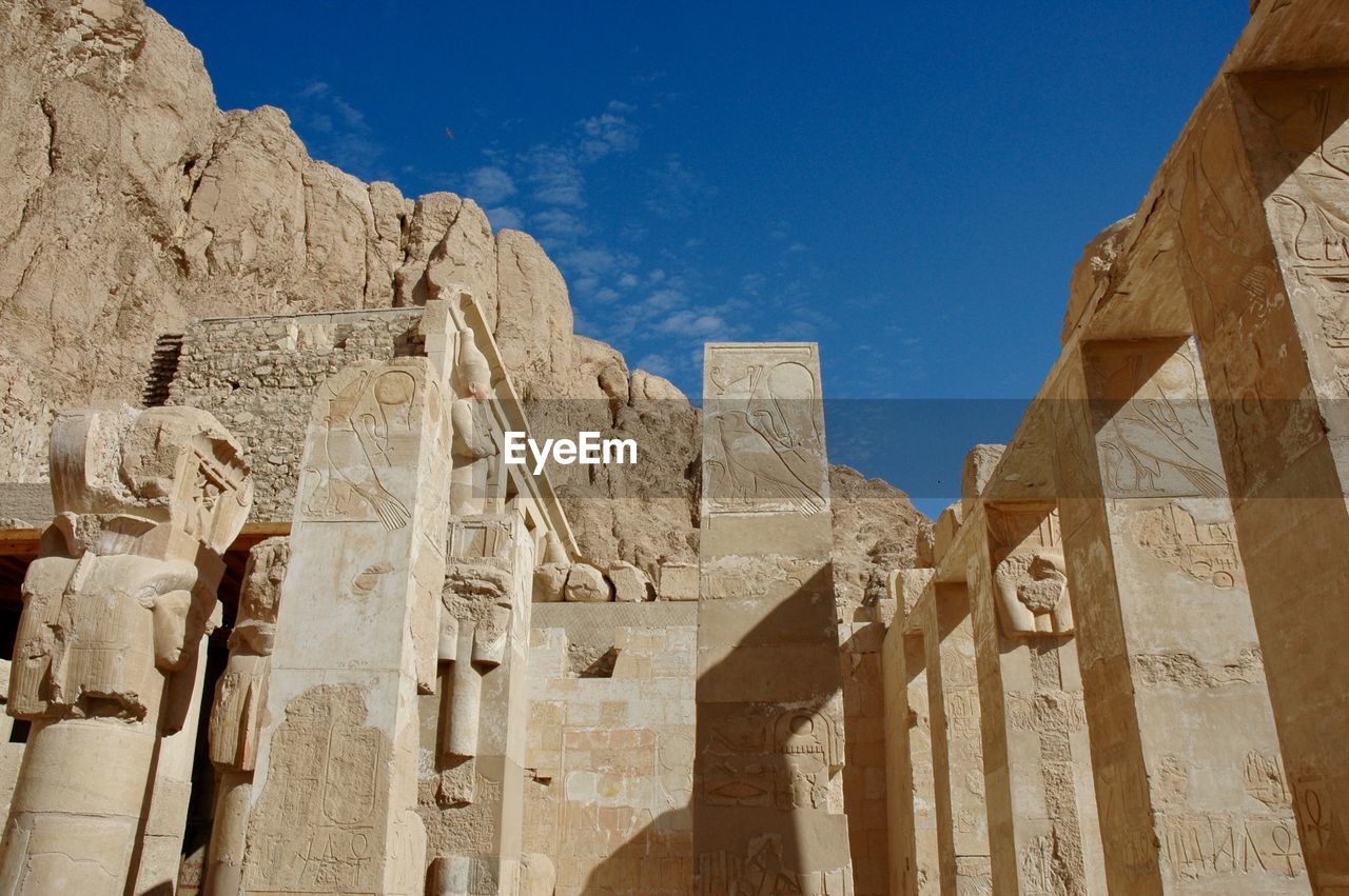 Low angle view of historic egyptian palace against sky